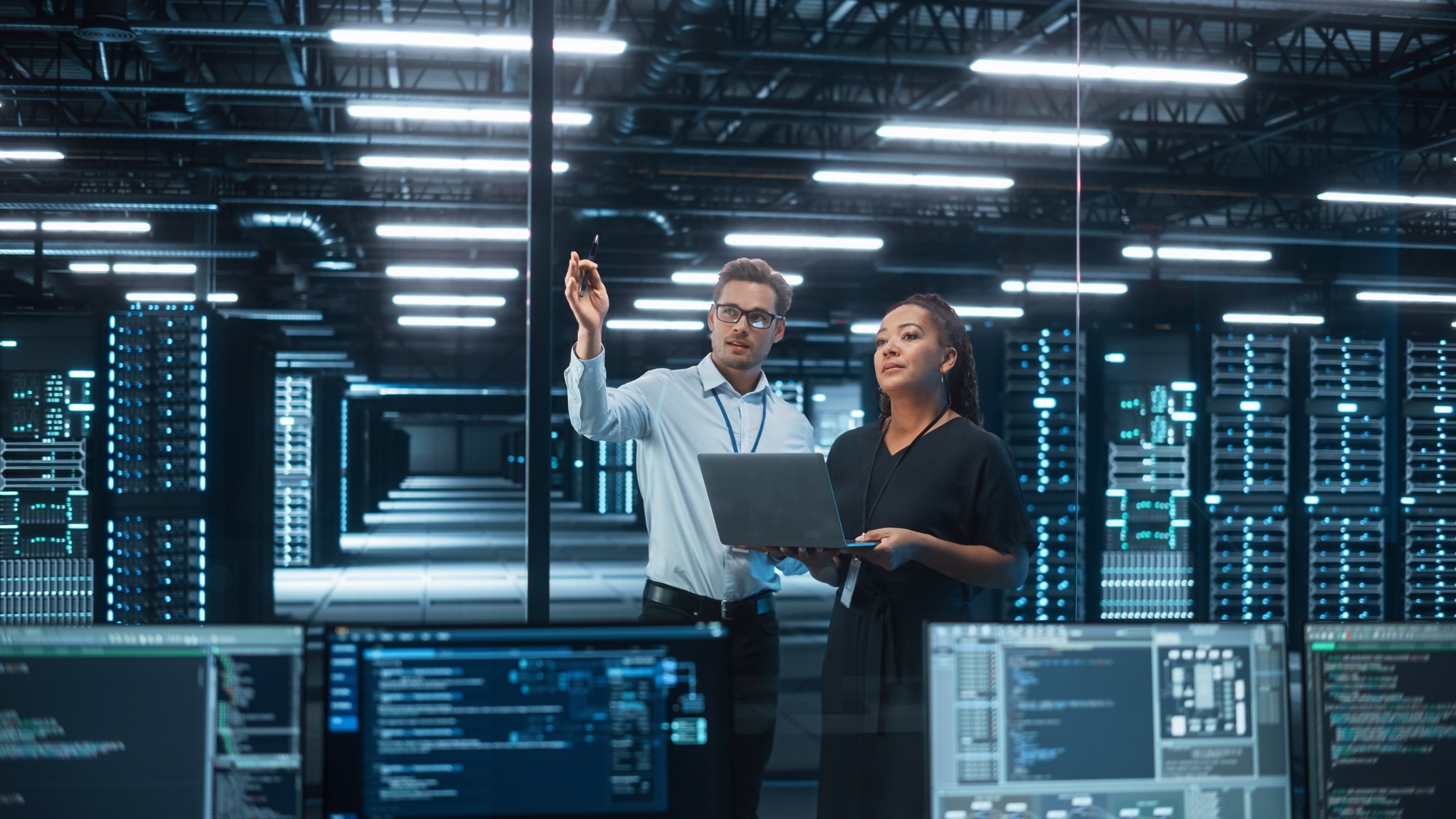 Diverse Big Data Center Server: E-Business Enrepreneur and It Specialist Talk, Use Laptop. Information Technology Engineer and System Administrator Monitoring Web Services Cloud Solution Software.